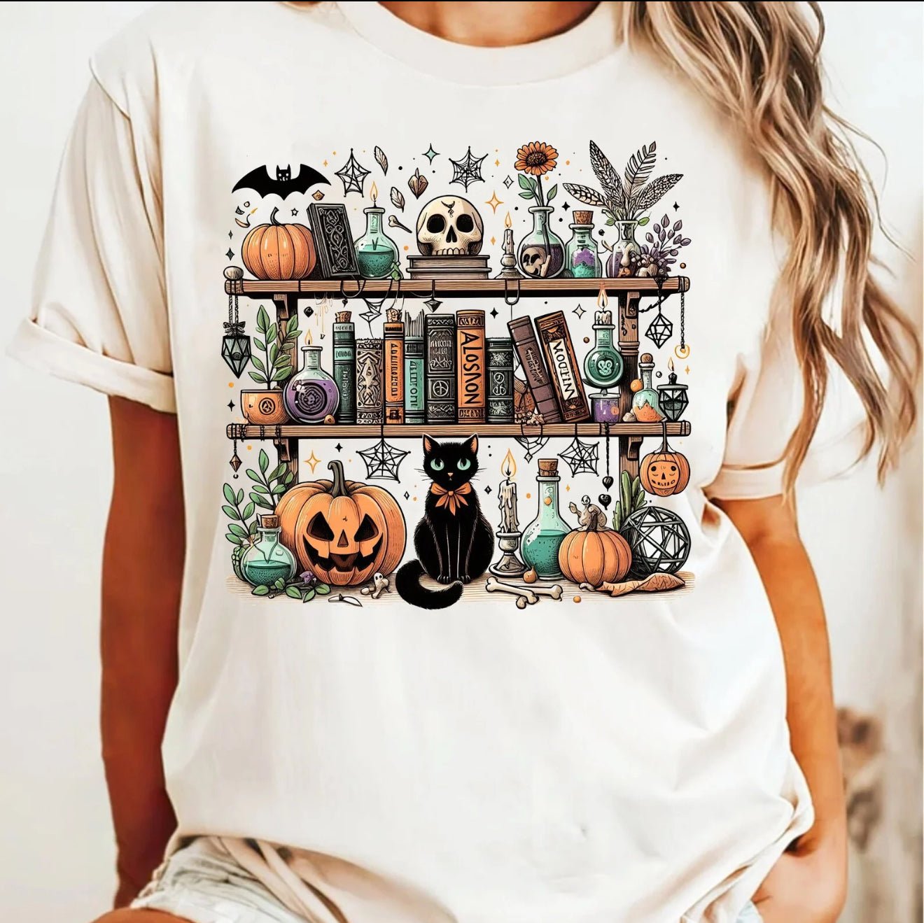 Spooky Bookshelf Shirt or Sweatshirt – Halloween Bookish Tee with Potions, Pumpkins & Cat, Cozy Witchcore Aesthetic - Daisy Designs & Creations, LLC