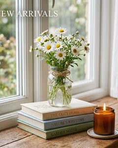 New arrivals featuring handmade gifts, cozy apparel, stationery, drinkware and accessories styled in a warm cottage-inspired setting.