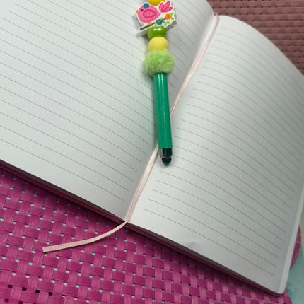 Beaded Stylus with little pink focal featuring a little pink song bird. Stylus is shimmering green with yellow silicone beads and fluffy green spacer 