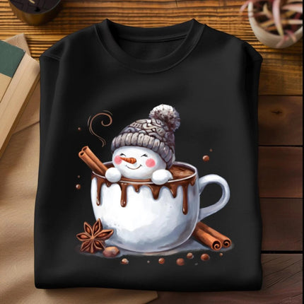 Black sweatshirt with a snowman design in a hot chocolate cup on a wooden surface.