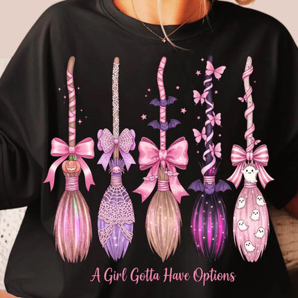 Black sweatshirt with decorative wand designs and text 'A Girl Gotta Have Options' worn by a person.