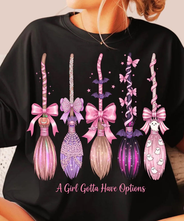 Black sweatshirt with decorative wand designs and text 'A Girl Gotta Have Options' worn by a person.