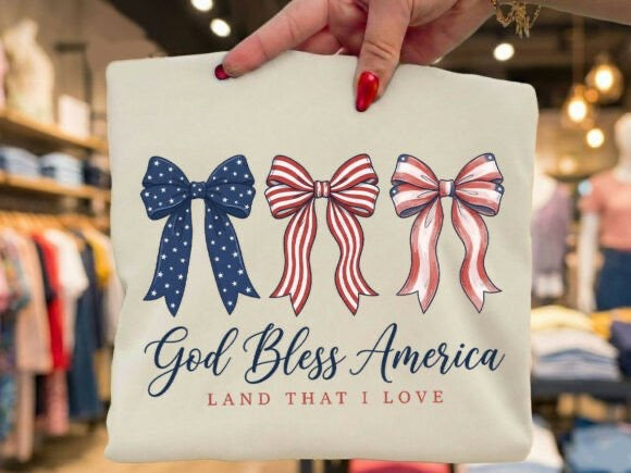 God Bless America Bow T-Shirt | Patriotic Coquette Tee | 4th of July Shirt | Red White Blue Bows Shirt | Soft Feminine Graphic Tee