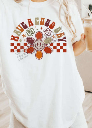 Retro Checkered “Have a Good Day” T-Shirt – Smiley Face Daisy Tee | Vibrant Positivity Shirt | Unisex Sizes S - 2XL - Daisy Designs & Creations, LLC