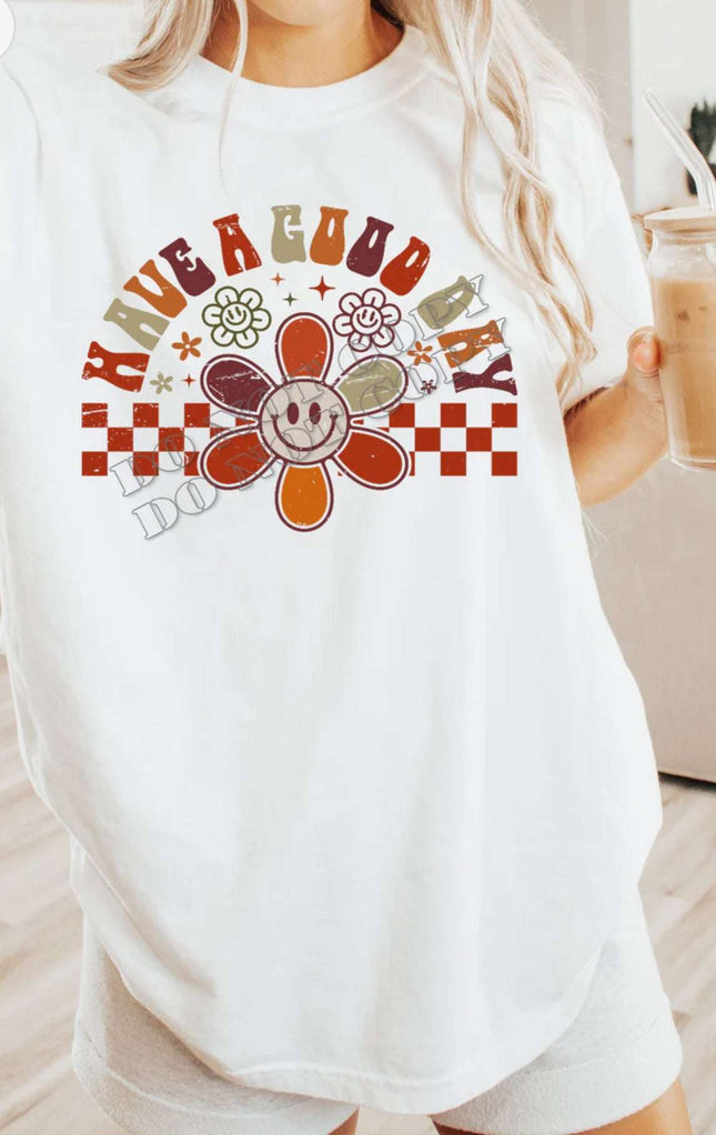 Retro Checkered “Have a Good Day” T-Shirt – Smiley Face Daisy Tee | Vibrant Positivity Shirt | Unisex Sizes S - 2XL - Daisy Designs & Creations, LLC